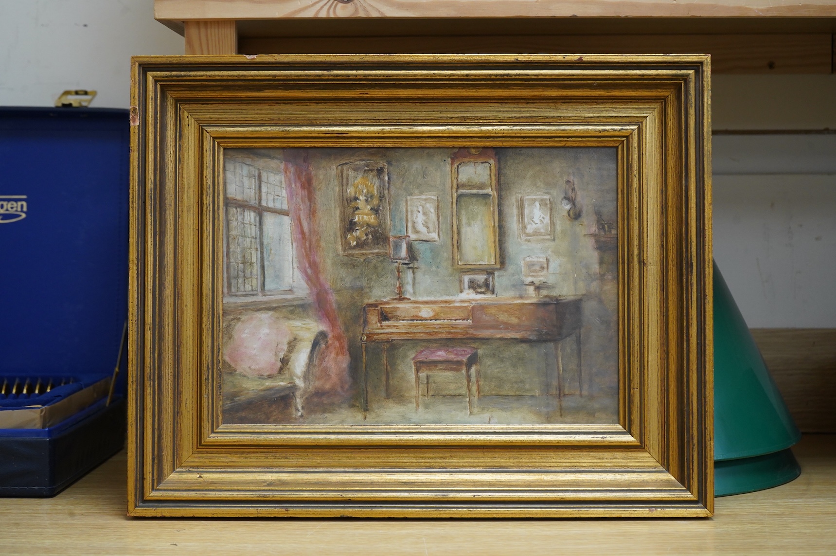 Gertrude Hardy (19th / 20th. C), Interior scene with piano, unsigned, inscribed in ink verso, oil on board, 23 x 33cm, gilt frame